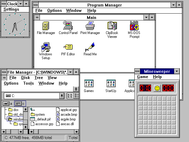Windows 3.1 Desktop with Program Manager, File Manager, and Clock (1992)